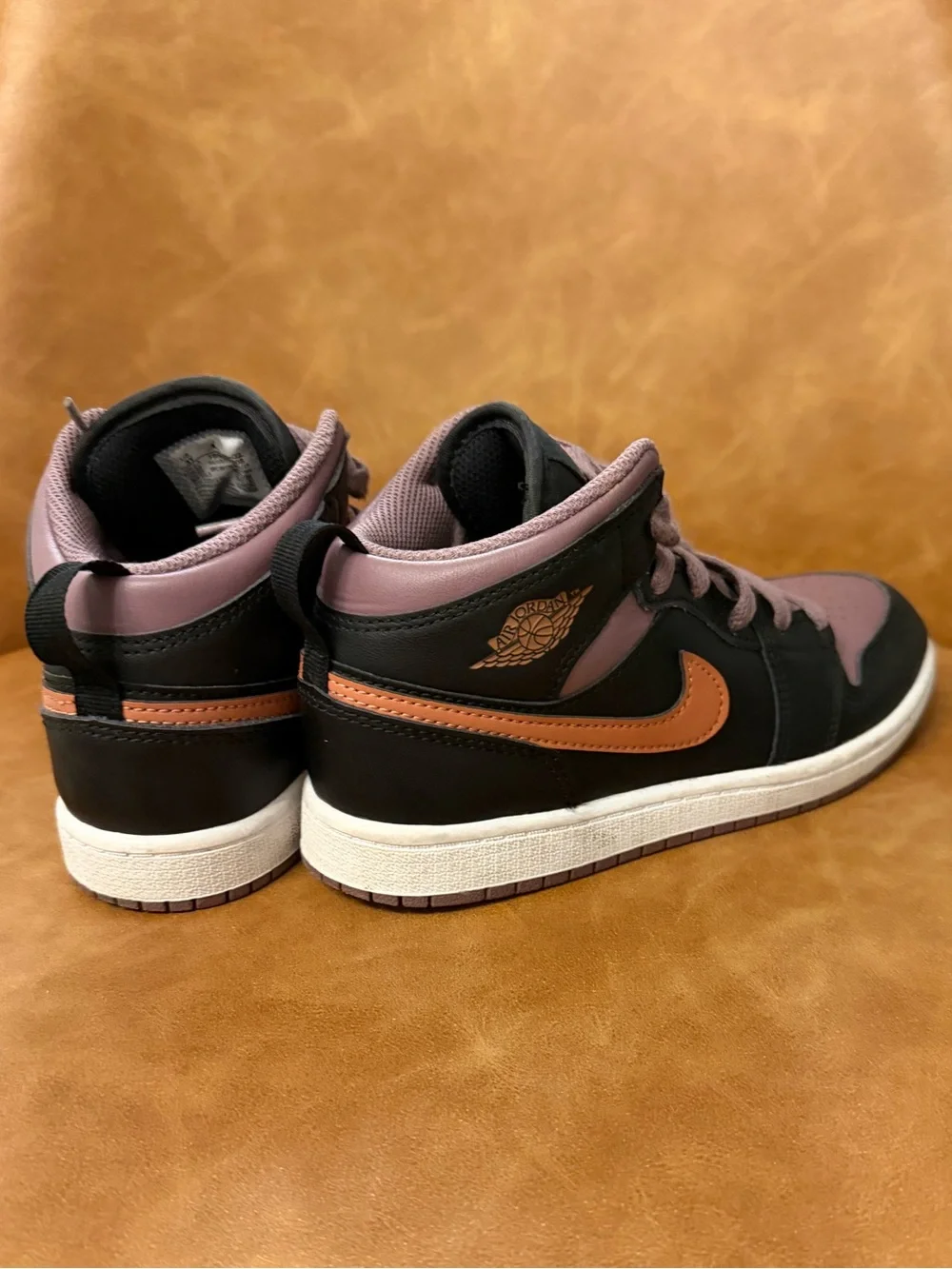Jordan Nike Kids' Mid-Top Sneakers in Black, Mauve, and Orange. Size 3Y